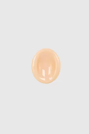 Worry stone orange lisse - petit galet en céramique rose, façonné à la main pour une expérience apaisante.